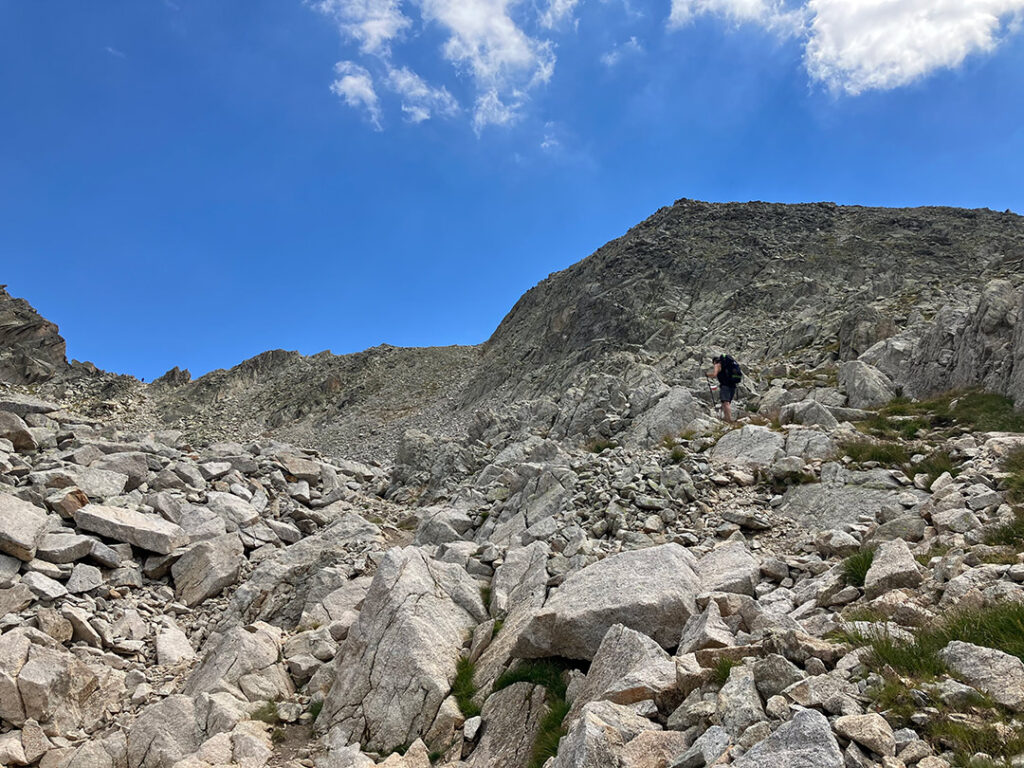 Christer climbing a rocky path up to Collado de Ballibierna 