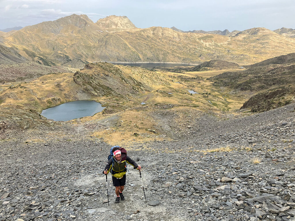 Philippe on his way up the mountain, leaving the lake behind