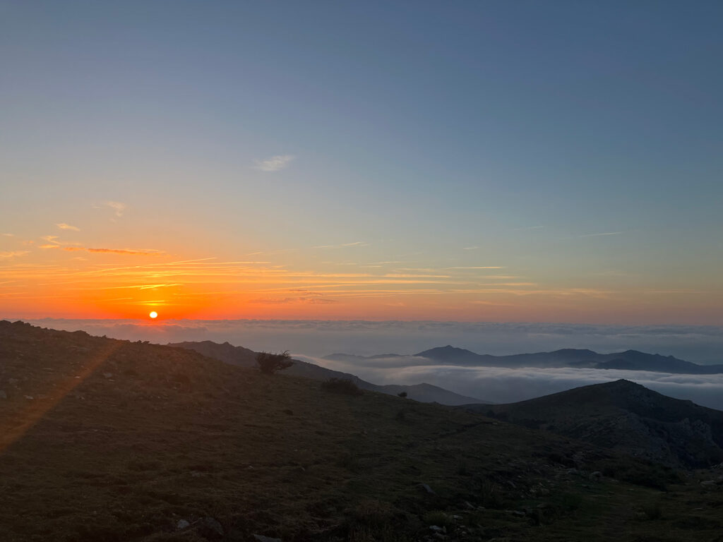 Sunrise in the mountain, above the clouds